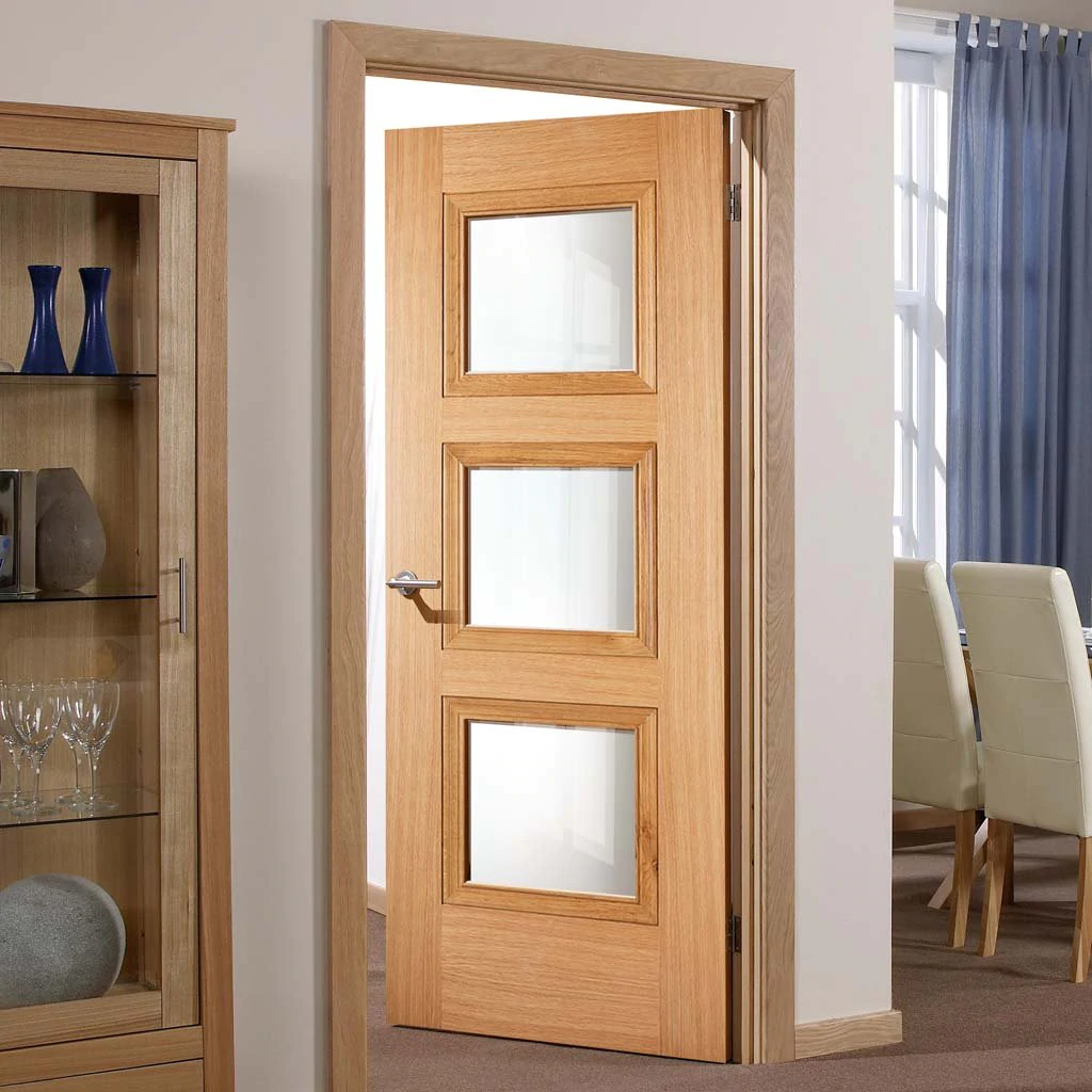 An oak wood glazed interior or internal door in a living room or dining room